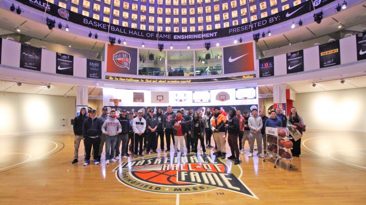 A group of students posing for a photo while on a tour of the Basketball Hall of Fame.