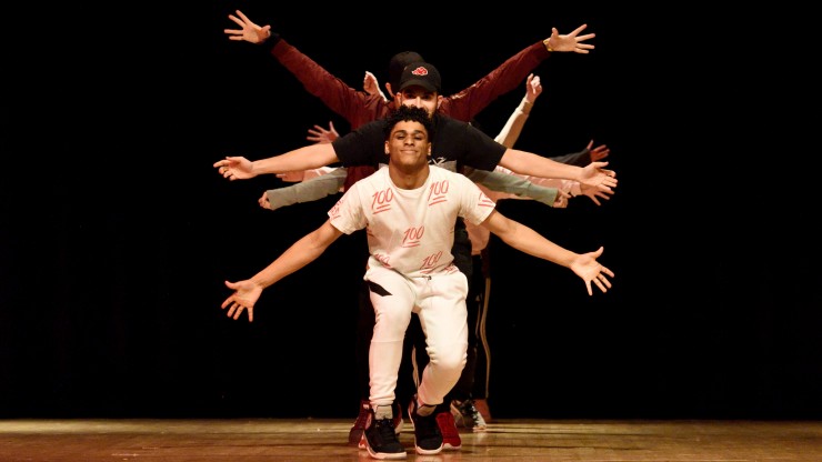 Multiple students performing a dance in the annual AMGT Talent Show.