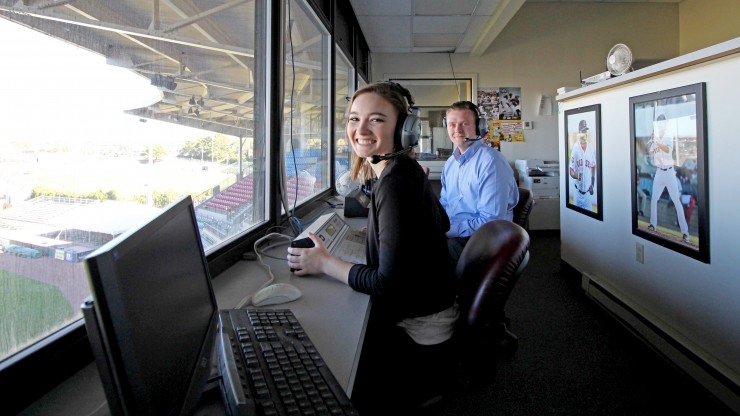 Two students sit in the press box at McCoy Stadium, home of the Pawtucket Red Sox.