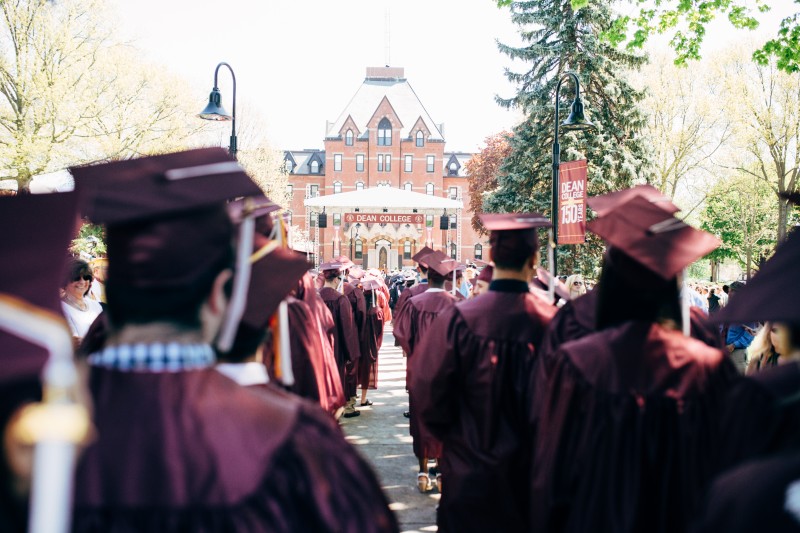 image of students wearing caps and gowns during the Dean College Commencement ceremony.