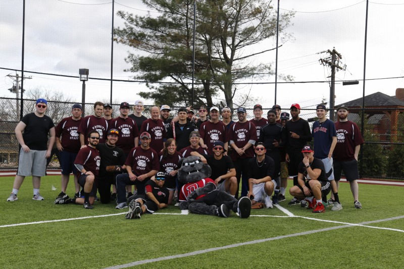 image of a group of faculty, staff and students during the Faculty & Staff vs. Students softball game.